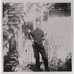 Lee Harvey Oswald Photos in Custody and Holding Rifle