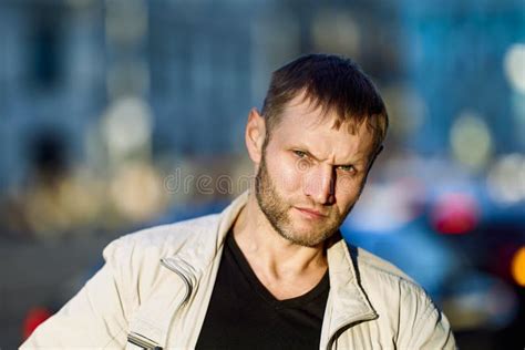 Portrait Of Frowning White Man With Stubble On Face Stock Image