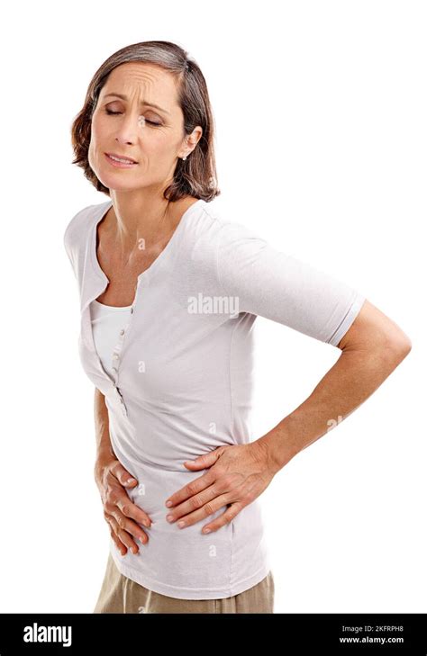 These Cramps Are Intense Studio Shot Of A Mature Woman Experiencing