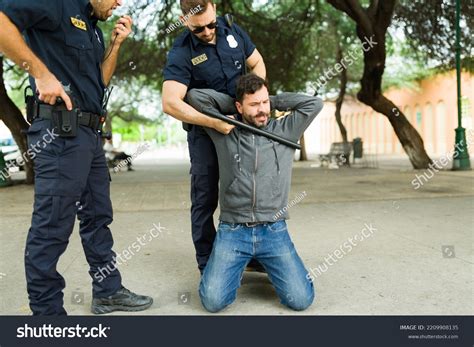 30 Police Agent Is Making A Arrest Images, Stock Photos & Vectors