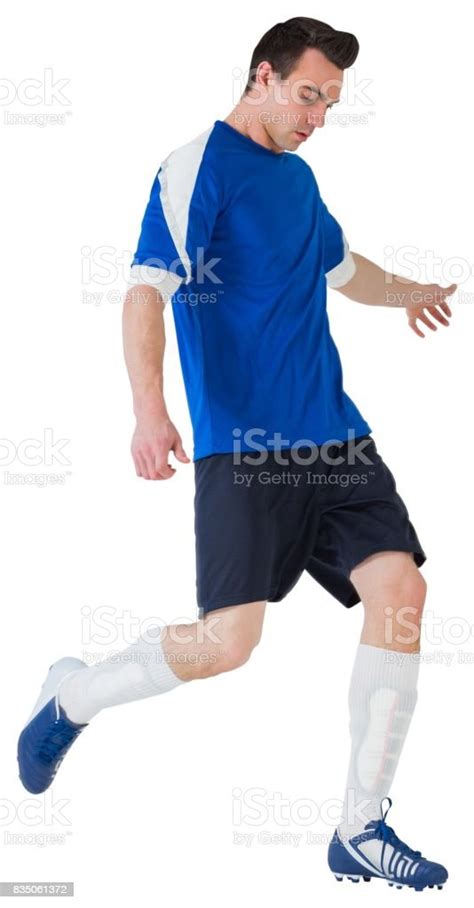 Football Player In Blue Kicking Stock Photo Download Image Now 20