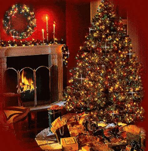 A Decorated Christmas Tree Sitting In Front Of A Fire Place