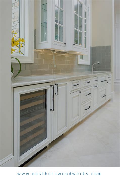 White Kitchen Cabinets With Decorative Raised Panel Doors And Appliance