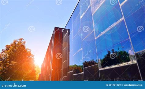 Architecture Details Modern Glass Building Facade In Sunny Day