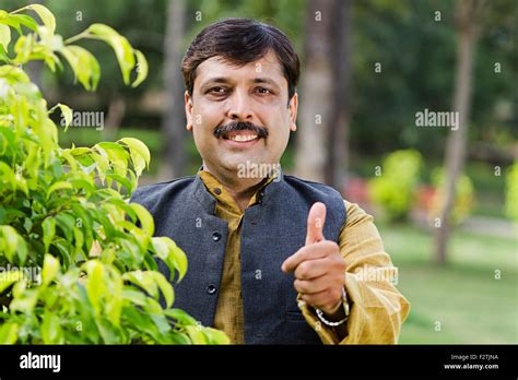 Indian Adult Man Standing Garden Thumbs Up Showing Stock Photo Alamy