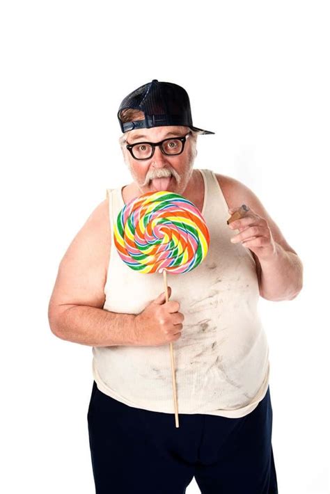 Fat Man With Stained Tank Top And Backwards Baseball Cap Licking