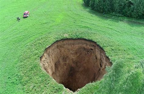 sinkhole as big as a 16 storey building appears overnight in russia ladbible