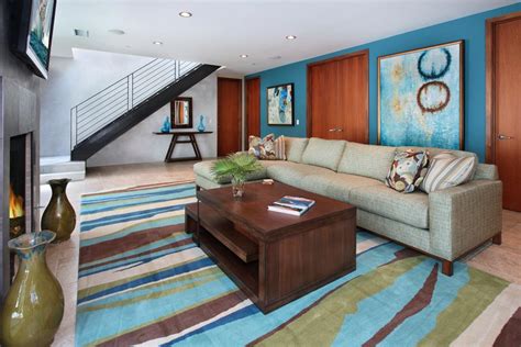 Living Room With Bold Rug And Blue Accent Wall Hgtv