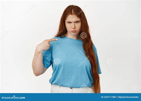 Angry Sulking Teen Girl With Red Long Hair Frowning Upset Pointing