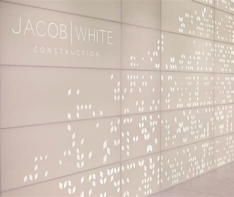 Backlit Perforated Corian Feature Wall | Office feature wall, Feature 