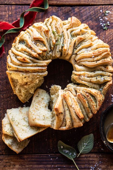 These edible wreaths are easy on the eyes and taste buds. Pull-Apart Garlic Butter Bread Wreath. - Half Baked Harvest