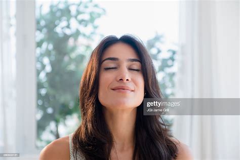 Calm Woman Breathing With Eyes Closed Photo Getty Images