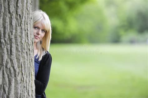 Young Woman Hiding Behind A Tree Stock Image Image Of Outside Adult 31555877