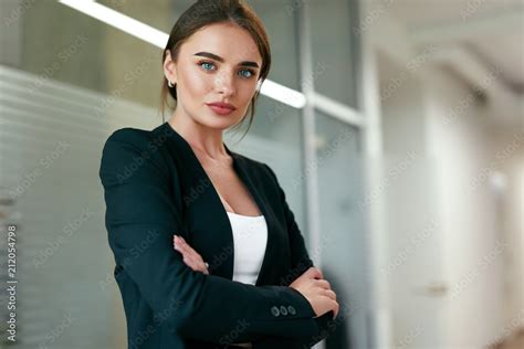 Foto Stock Beautiful Business Woman In Office Portrait Adobe Stock