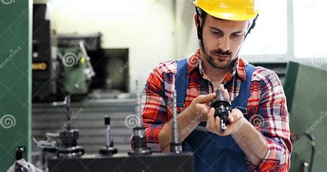 Male Worker And Quality Control Inspection In Factory Stock Image