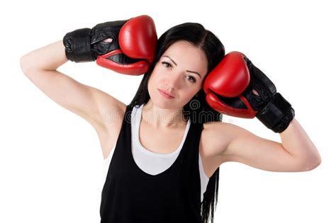 Young Beautiful Girl In Red Boxing Gloves Is Training A Kick Stock