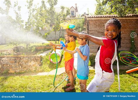 Boys And Girls In The Middle Of Water Gun Fight Stock Image Image Of