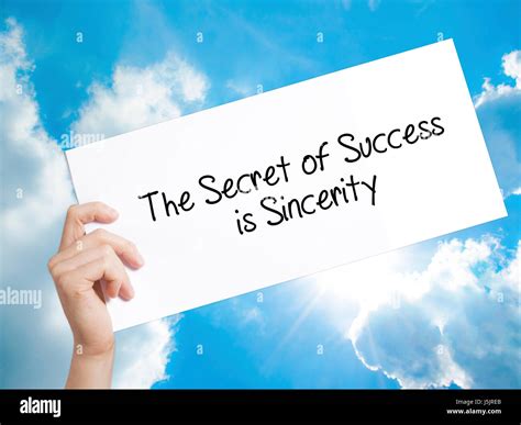 The Secret Of Success Is Sincerity Sign On White Paper Man Hand