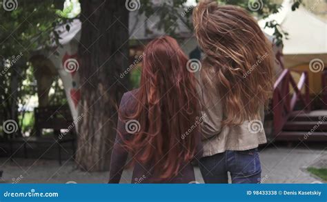 Two Crazy Redheads Girlfriends Having Fun Frolic And Jump The View From The Back Slow Motion