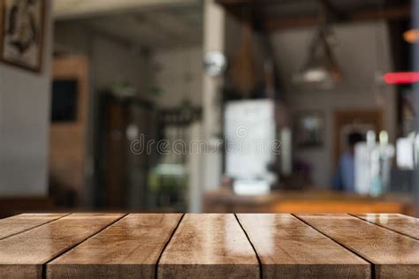 Empty Old Wood Table Top With Bokeh Coffee Shop Interior Background 3d
