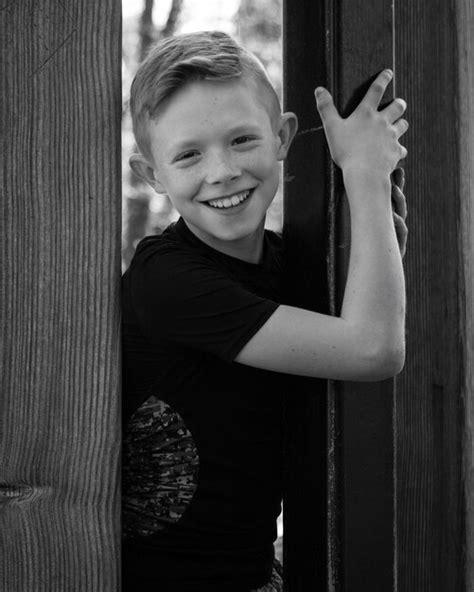 Premium Photo Portrait Of Happy Boy Standing Outdoors