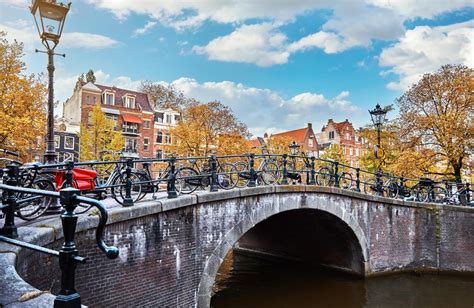 Bridge Over Channel In Amsterdam Netherlands Houses River Amstel Stock