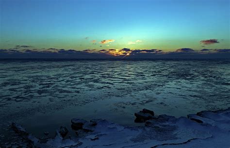 Sunrise Over A Frozen Lake Michigan Photograph By Steve Bell Fine Art