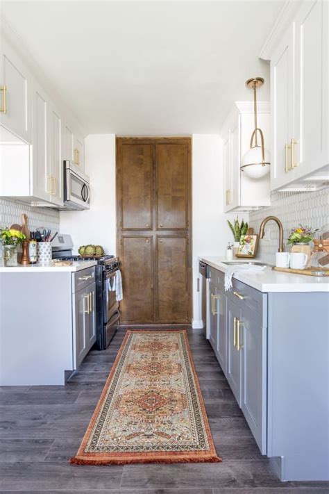 Tuxedo effect cabinets blending light and dark cabinets adds an artistic touch to your kitchen. Move Over Two-Color Tuxedo Kitchens: A Big New Trend is Here | Kitchen cabinets painted grey ...