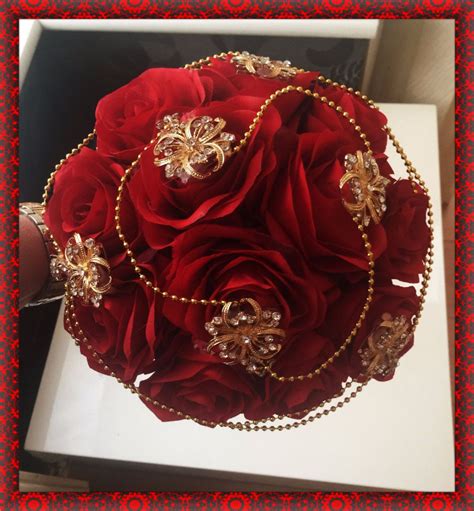 Maybe you would like to learn more about one of these? Brides Wedding Bouquet Red Roses with Gold brooches and ...