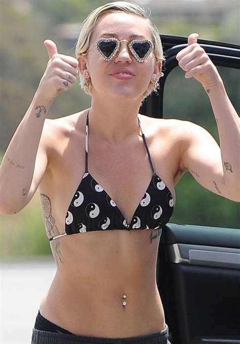 She shared a selfie of herself. Miley Cyrus Shows Off Pink Armpit Hair in Men's Sneakers