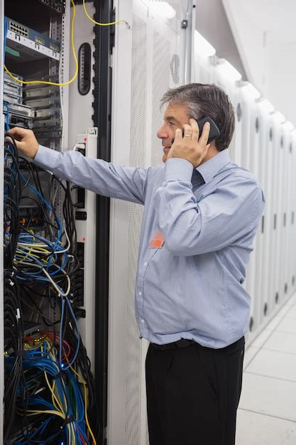 Premium Photo Male Technician Phoning While Repairing A Server