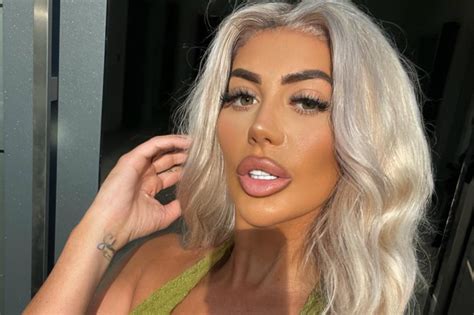 Chloe Ferry Shows Off Her Stunning Curves In A Skin Tight Pink Swimsսit While Soaking In An Ice Bath