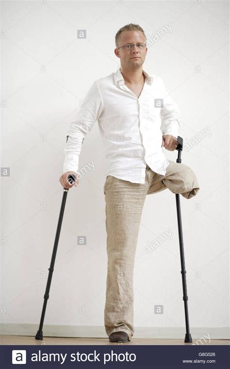 Download This Stock Image Male Amputee Standing With Crutches G8g526