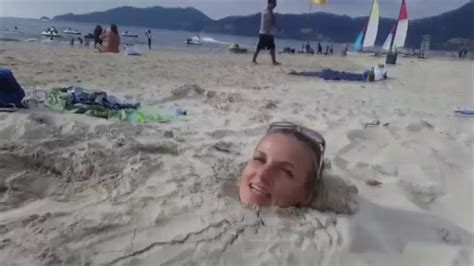 GIRL BURIED IN SAND YouTube