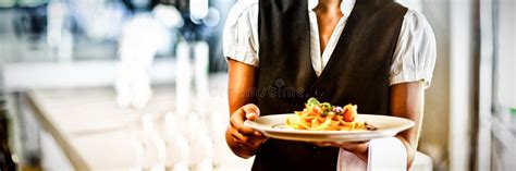 Waitress Holding Plate Of Meal In A Restaurant Stock Photo Image Of