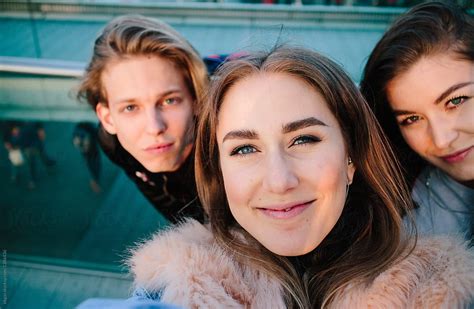 Cute Twenties Friends Taking Selfies In London By Stocksy Contributor