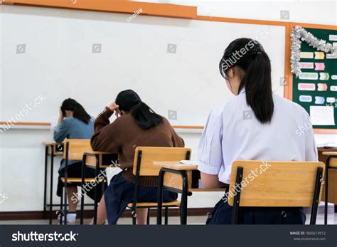 Writing Test Exam Behind Girl Asian Stock Photo 1860619912 Shutterstock