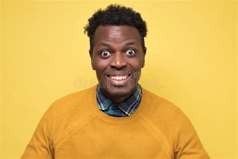 African Young Man With Excited Emotional Facial Expression Stock Photo