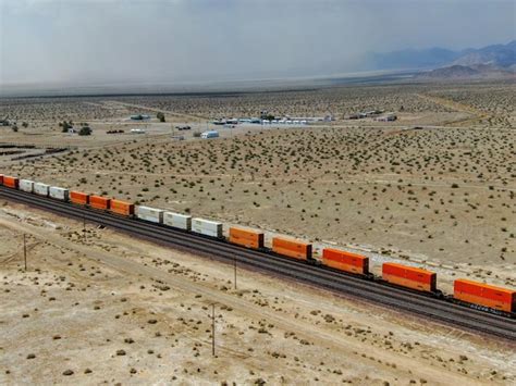 Premium Photo Cargo Locomotive Train Crossing Arizona Desert