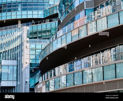 Close Up Of A Facade Of A Glass Skyscraper In An Urban Center Stock