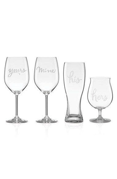 Four Wine Glasses With Names On Them Sitting Next To Each Other