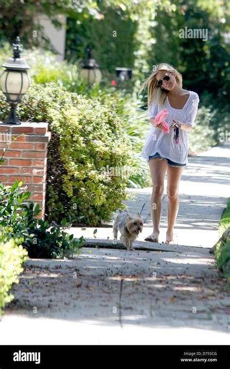 Kristin Cavallari Talking On Her Cell Phone While Walking Her Dog In