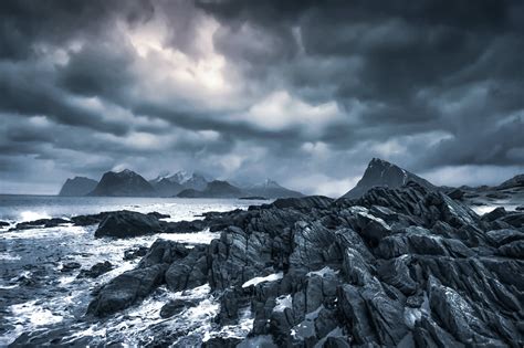 Stormy Sea Near Rocks Under Cloudy Sky In Overcast Weather · Free Stock