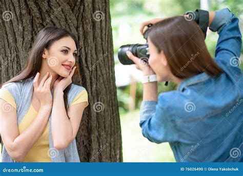 Joyful Photographer Taking Shots Of Lady Stock Photo Image Of Friend