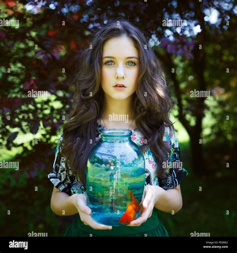 Young Girl With Gold Fish At Summer Time Stock Photo Alamy