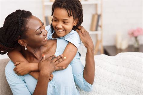 african american mother and daughter hugging at home stock image image of mother beautiful