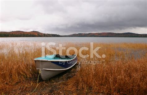 Boat By Lake In Autumn Stock Photo Royalty Free Freeimages