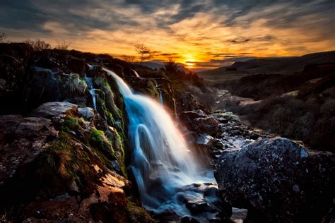 Beautiful Waterfall At Dusk With Mossy Rocks Image Free Stock Photo