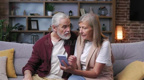 Mature Happy Couple Fooling Around On Smartphone Camera Gray Haired