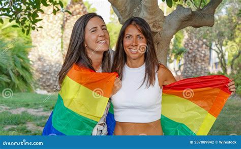 Spanish Lesbian Couple Posing With A Pride Flag Stock Photo Image Of
